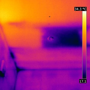 An entire area of missing insulation visible between the rafters. This was responsible for great heat loss. 