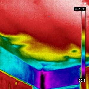 The insulation between the rafters has been blown away from the wall by the airflow up under the eves into the roof. This means that air circles under the ceiling plasterboard and drafts blow through the room. This occurs on many properties which require roof ventilation and is a common explanation for drafts. Thermal imaging surveys can identify areas where insulation has moved or blown away from where it should be. 